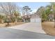 Two-story house with a two-car garage and landscaping at 320 Muirfield Rd., Myrtle Beach, SC 29588