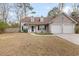 Brick front of charming house with 2-car garage at 320 Muirfield Rd., Myrtle Beach, SC 29588