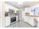 Modern kitchen with stainless steel appliances and tile flooring at 320 Muirfield Rd., Myrtle Beach, SC 29588