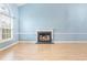 Living room with fireplace and light hardwood flooring at 320 Muirfield Rd., Myrtle Beach, SC 29588