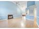 Spacious living room with light blue walls and fireplace at 320 Muirfield Rd., Myrtle Beach, SC 29588