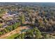 Aerial view of a residential area with houses and green spaces at 34 Pipedown Way, Pawleys Island, SC 29585