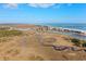 Aerial view of a coastal area with marsh and waterway at 34 Pipedown Way, Pawleys Island, SC 29585