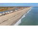 Aerial view of beach homes and shoreline at 34 Pipedown Way, Pawleys Island, SC 29585