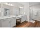 Elegant bathroom with double vanity, large mirror, and a walk-in shower at 34 Pipedown Way, Pawleys Island, SC 29585