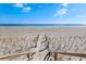 Wooden walkway leading to a sandy beach at 34 Pipedown Way, Pawleys Island, SC 29585