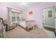 Pastel-colored bedroom with crib and rocking horse at 34 Pipedown Way, Pawleys Island, SC 29585