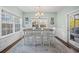 Bright dining room with a table for six and access to the backyard at 34 Pipedown Way, Pawleys Island, SC 29585