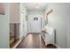 Bright and airy entryway with a bench, coat rack, and staircase at 34 Pipedown Way, Pawleys Island, SC 29585