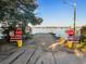 View of a road ending at a river access point with stop signs at 34 Pipedown Way, Pawleys Island, SC 29585