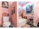 Pink bathroom with a bathtub, toilet, and decorative accents at 35 Easter Lilly Ct., Murrells Inlet, SC 29576