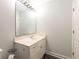 Simple bathroom with a single vanity and large mirror at 35 Easter Lilly Ct., Murrells Inlet, SC 29576