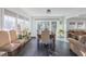 Sunlit dining area with dark wood table and seating for six at 35 Easter Lilly Ct., Murrells Inlet, SC 29576