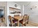 Small dining area with wood table and chairs at 3610 S Ocean Blvd. # 316, North Myrtle Beach, SC 29582