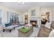 Cozy living room with fireplace and plenty of natural light at 3737 Kingsley Dr., Myrtle Beach, SC 29588