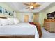 King-size bed in main bedroom with access to ensuite bathroom at 3737 Kingsley Dr., Myrtle Beach, SC 29588