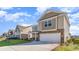 Two-story house with beige siding, stone accents, and a two-car garage at 382 Glacier Way, Conway, SC 29526