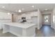 Modern kitchen with white cabinets, quartz countertops and island at 382 Glacier Way, Conway, SC 29526