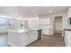 Modern kitchen with white cabinets, quartz countertops, and island at 382 Glacier Way, Conway, SC 29526