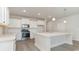 Modern kitchen with white cabinets, stainless steel appliances, and an island at 382 Glacier Way, Conway, SC 29526