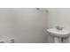 Small half bathroom with pedestal sink and grab bar at 382 Glacier Way, Conway, SC 29526