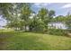 Large grassy backyard with chain link fence at 3845 Woodridge Circle, Little River, SC 29566