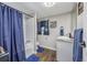 Bathroom featuring a bathtub, shower, and blue accents at 3845 Woodridge Circle, Little River, SC 29566