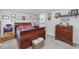 Cozy bedroom featuring a sleigh bed and ample dresser storage at 3845 Woodridge Circle, Little River, SC 29566