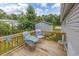 Relaxing wooden deck with seating, overlooking the backyard at 3845 Woodridge Circle, Little River, SC 29566