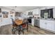 Bright kitchen with stainless steel appliances and an adjacent laundry area at 3845 Woodridge Circle, Little River, SC 29566