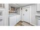 Convenient laundry room with washer and dryer, located near the kitchen at 3845 Woodridge Circle, Little River, SC 29566