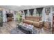 Living room featuring a leather couch and wood floors at 3845 Woodridge Circle, Little River, SC 29566