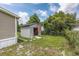 Gray storage shed with double doors in backyard at 3845 Woodridge Circle, Little River, SC 29566