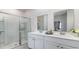 Modern bathroom with double sinks, a shower, and stylish decor at 4027 Smokey Dr, Conway, SC 29526