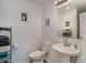 Simple bathroom includes pedestal sink, toilet, and built-in shelving at 405 Garden Dr. # 106A, Surfside Beach, SC 29575