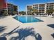 Community pool with surrounding lounge chairs at 417 S Dunes Dr., Pawleys Island, SC 29585