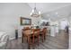 Dining room open to kitchen with seating for four and stylish mirror at 4210 Coquina Harbour Dr. # A-16, Little River, SC 29566