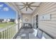 Cozy screened porch featuring comfortable seating and scenic views at 4210 Coquina Harbour Dr. # A-16, Little River, SC 29566