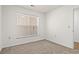 Well-lit bedroom featuring neutral walls and carpet at 4243 Villa Dr. # 502, Little River, SC 29566