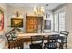 Elegant dining room with a rustic wooden table and charming wall art at 4323 Lotus Ct. # G, Murrells Inlet, SC 29576