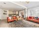 Elegant living room with a leopard print rug and orange leather sofas at 4323 Lotus Ct. # G, Murrells Inlet, SC 29576