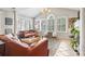 Living room with leather couches, a large window, and a fireplace at 4323 Lotus Ct. # G, Murrells Inlet, SC 29576