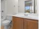 Bathroom with wood vanity and a view of backyard at 4387 Heartwood Ln., Myrtle Beach, SC 29579