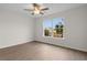 Well-lit bedroom with ceiling fan and window view at 4387 Heartwood Ln., Myrtle Beach, SC 29579