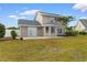 Two story home with neutral siding and backyard patio at 4387 Heartwood Ln., Myrtle Beach, SC 29579