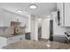 Modern kitchen with white cabinets, granite countertops, and stainless steel appliances at 4387 Heartwood Ln., Myrtle Beach, SC 29579