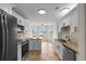 Modern kitchen with white cabinets, granite counters and stainless steel appliances at 4387 Heartwood Ln., Myrtle Beach, SC 29579