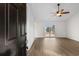 Bright living room with hardwood floors and sliding glass doors at 4387 Heartwood Ln., Myrtle Beach, SC 29579