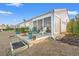 Backyard patio with furniture, planters, and access to the sunroom in a charming home at 4451 Livorn Loop # 4451, Myrtle Beach, SC 29579