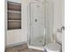 Bathroom with shower stall, toilet, and shelving at 45 Steve Carmichael Rd., Hemingway, SC 29554